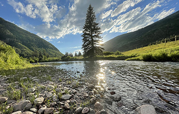 sun reflecting on Gore Creek