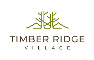 Logo for Timber Ridge Village that features abstract trees and mountains in green and the name in all caps in grey